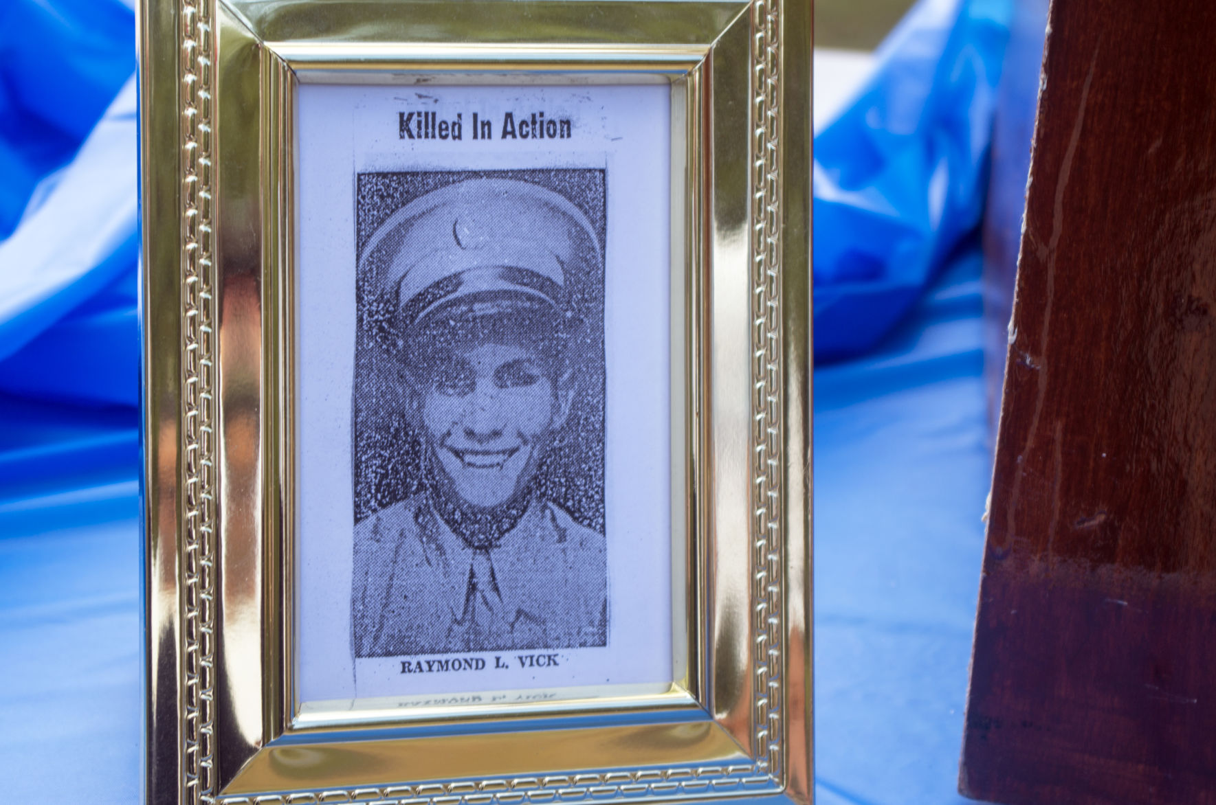 Framed newspaper clipping showing Pfc. Raymond Vick, who was killed in action during WWII